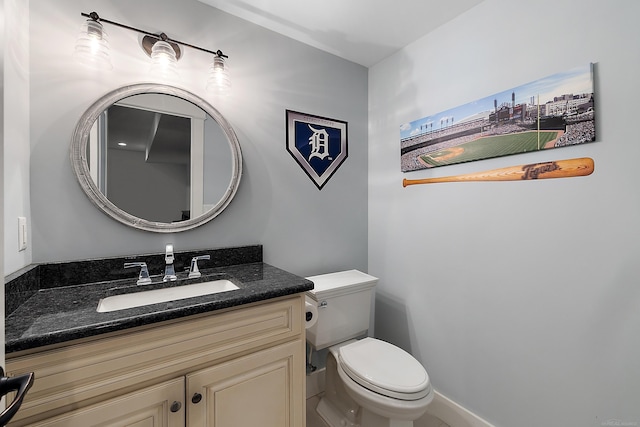 bathroom featuring toilet and vanity