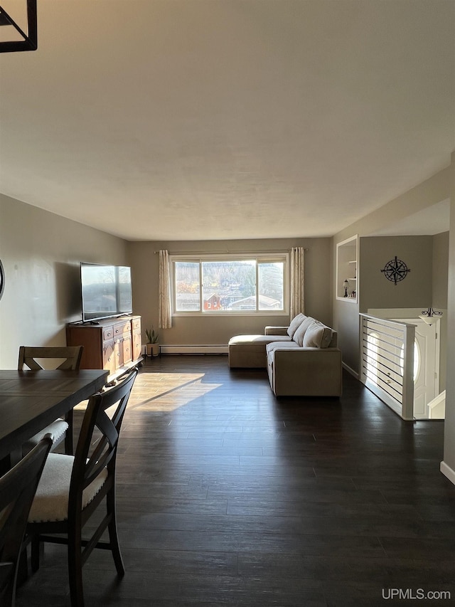 living room featuring baseboards and wood finished floors