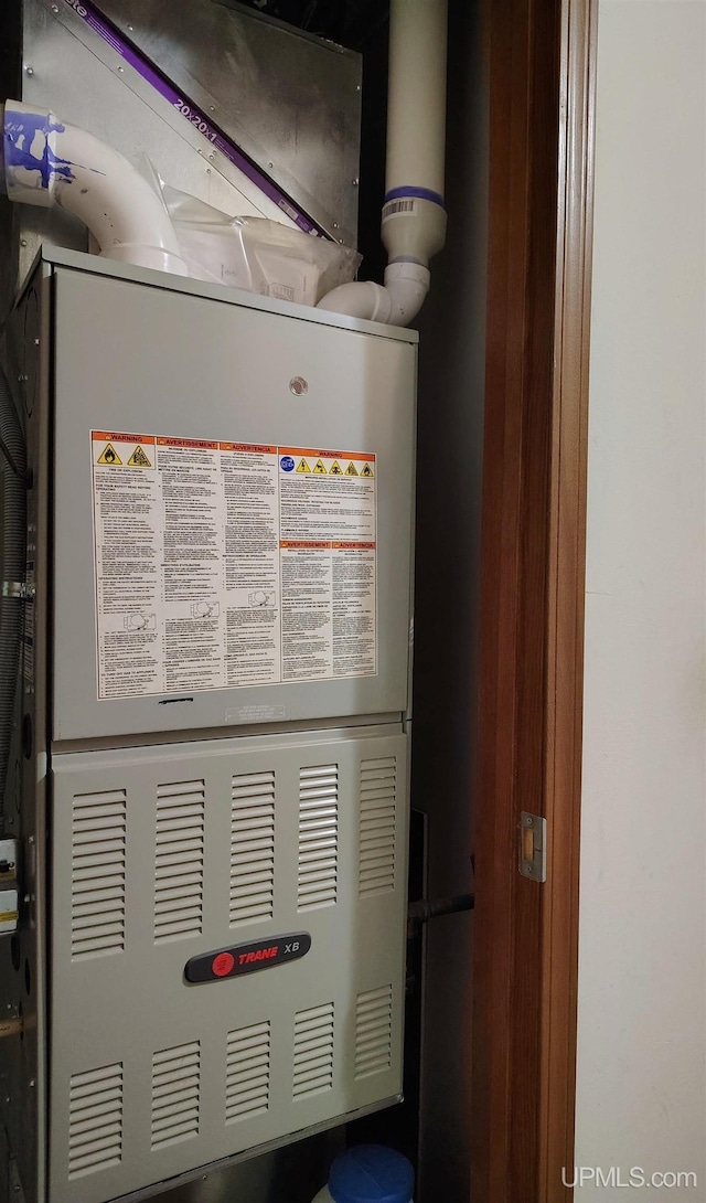 utility room with heating unit