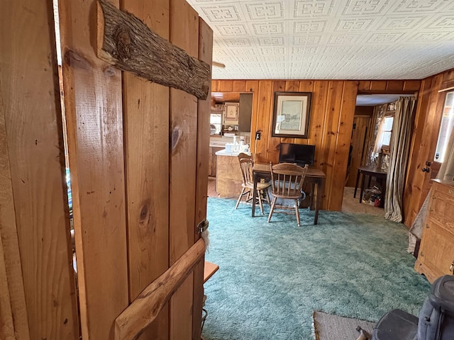 interior space with wood walls and an ornate ceiling