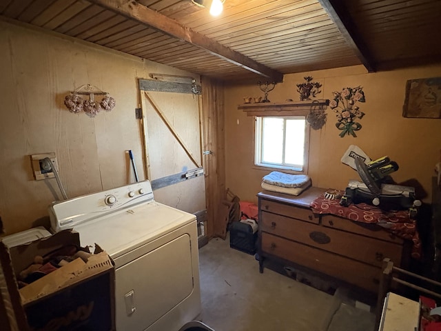 clothes washing area with wood ceiling, washer / clothes dryer, and laundry area