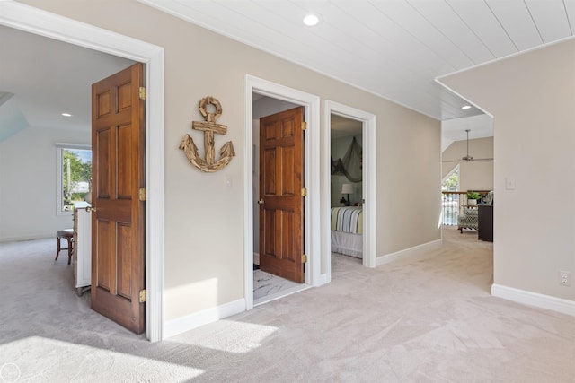 corridor with recessed lighting, baseboards, carpet floors, and plenty of natural light