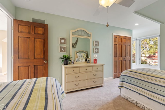 bedroom featuring recessed lighting, light colored carpet, a closet, baseboards, and a ceiling fan