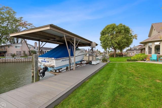 view of dock featuring a residential view, a yard, boat lift, and a water view