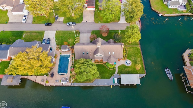 birds eye view of property featuring a water view and a residential view