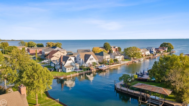 bird's eye view featuring a residential view and a water view