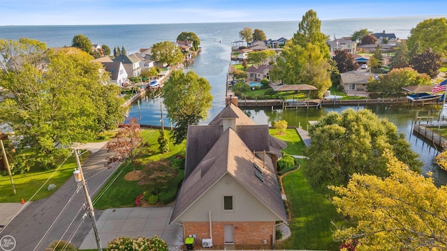 birds eye view of property with a residential view and a water view