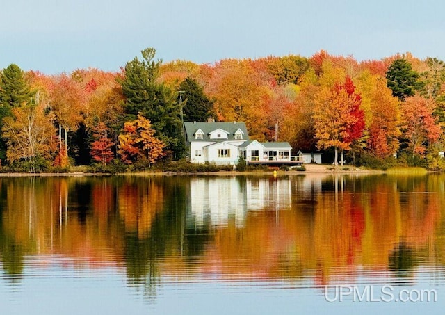 property view of water with a wooded view