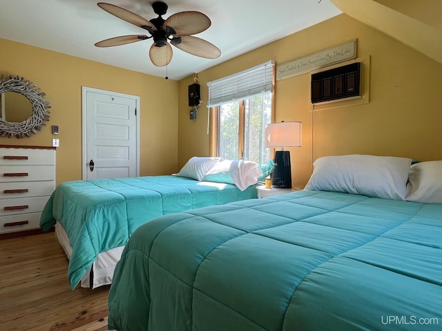 bedroom with a ceiling fan and wood finished floors