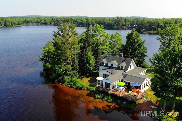 bird's eye view with a water view and a view of trees