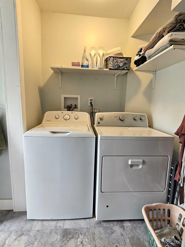 clothes washing area with laundry area and washing machine and dryer