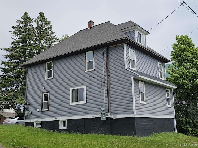 view of property exterior with a chimney