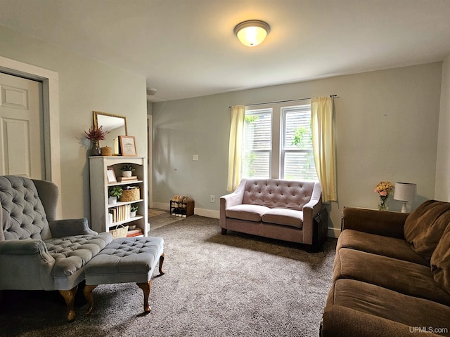 carpeted living area with baseboards