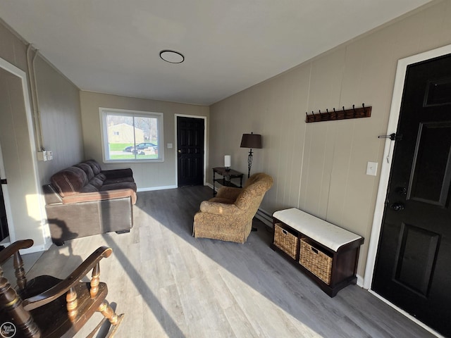35734 Weideman St, Clinton Township, MI 48035 - living area featuring wood finished floors, a baseboard heating unit, and baseboards