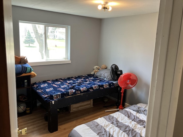 bedroom featuring wood finished floors