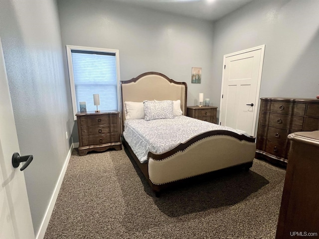 carpeted bedroom featuring baseboards