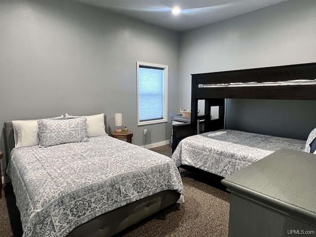 carpeted bedroom featuring baseboards