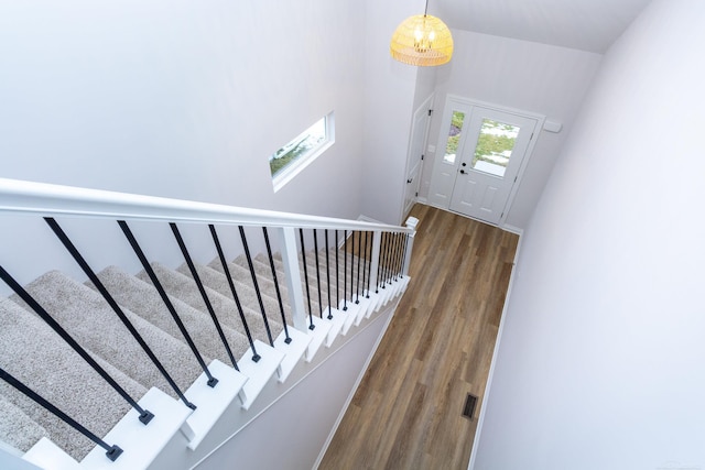 staircase featuring wood finished floors