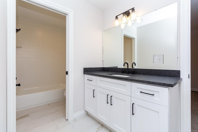 bathroom with marble finish floor, shower / bathing tub combination, toilet, vanity, and baseboards