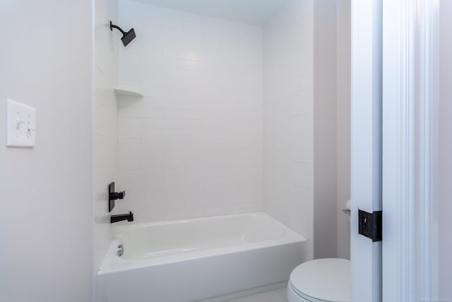 bathroom with toilet and tub / shower combination