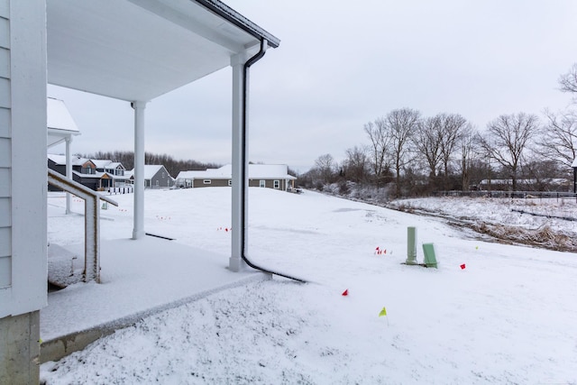 view of yard layered in snow