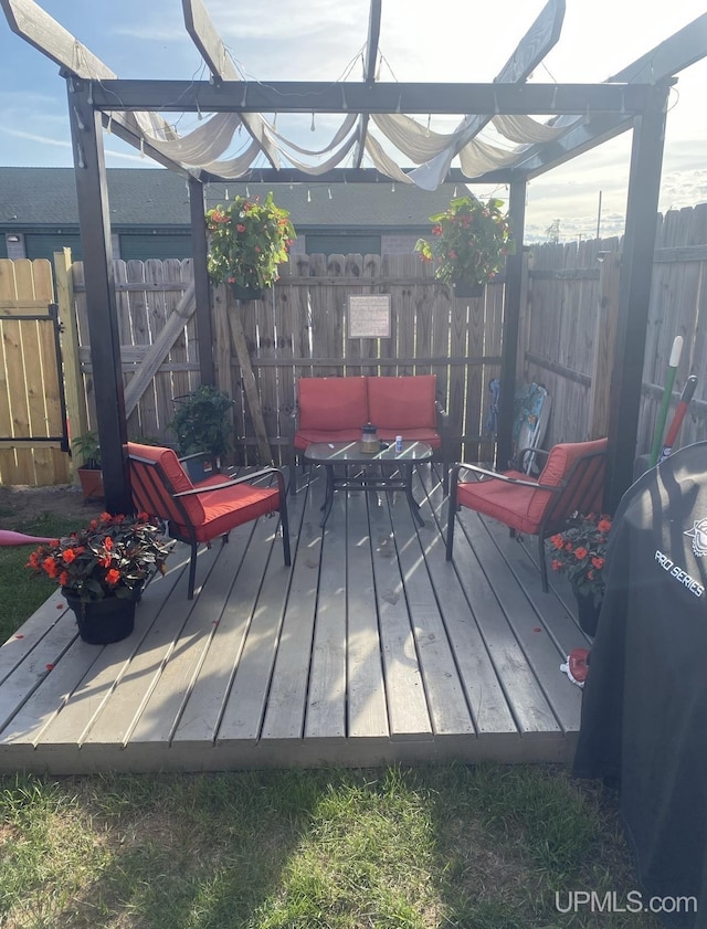 wooden terrace featuring fence and area for grilling