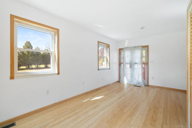 4358 Lakeshore Rd, Lexington, MI 48450 - empty room featuring baseboards, visible vents, and wood finished floors
