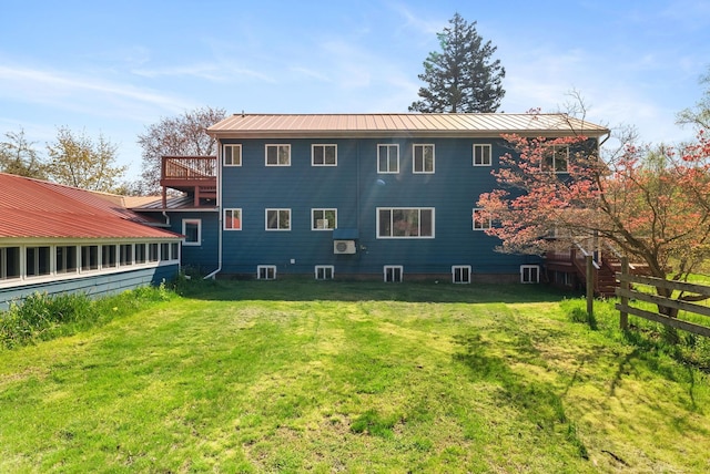 4358 Lakeshore Rd, Lexington, MI 48450 - back of house featuring fence, metal roof, a yard, and central air condition unit