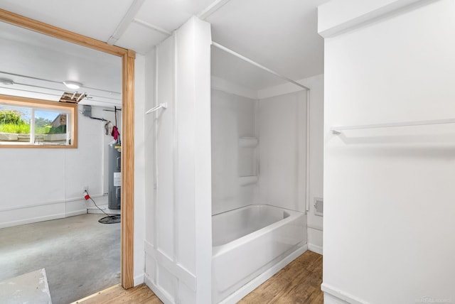4358 Lakeshore Rd, Lexington, MI 48450 - bathroom featuring baseboards, bathing tub / shower combination, and water heater