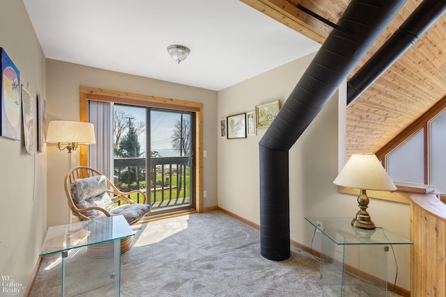 entryway featuring baseboards and carpet flooring