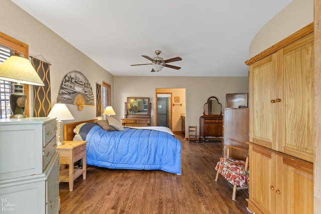 bedroom with a ceiling fan and dark wood-style floors