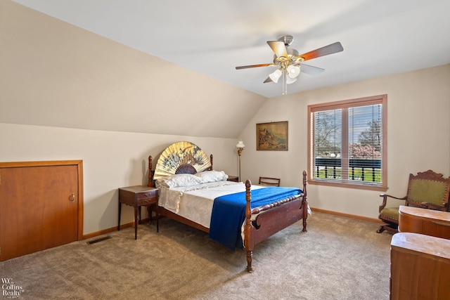 bedroom with visible vents, baseboards, vaulted ceiling, and carpet floors
