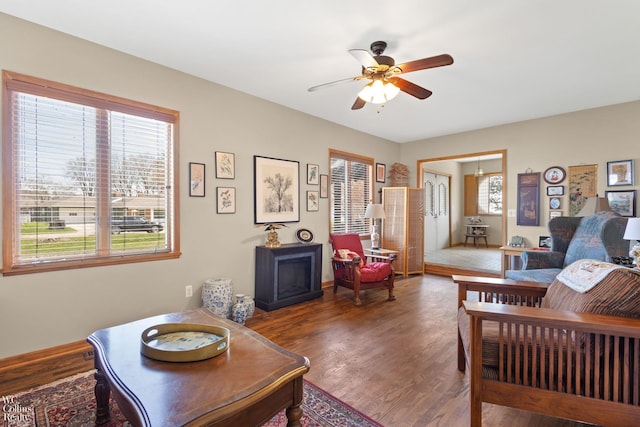 living room featuring wood finished floors and ceiling fan