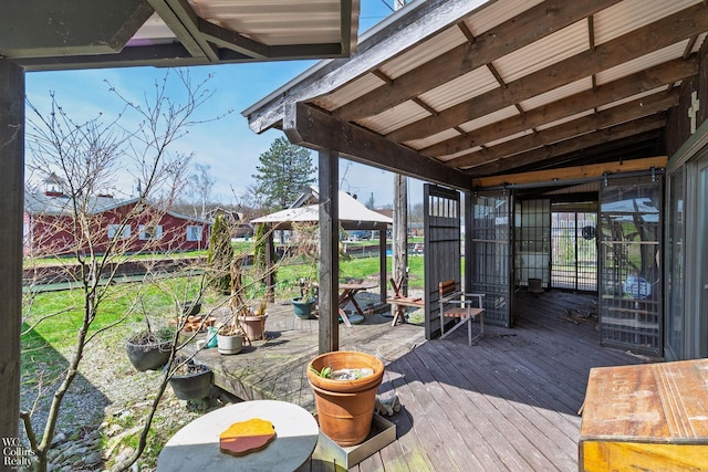 wooden terrace with a gazebo