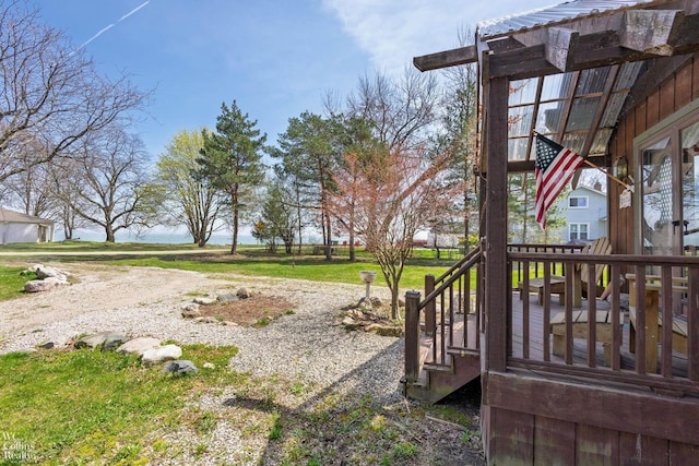 view of yard with a deck and stairway