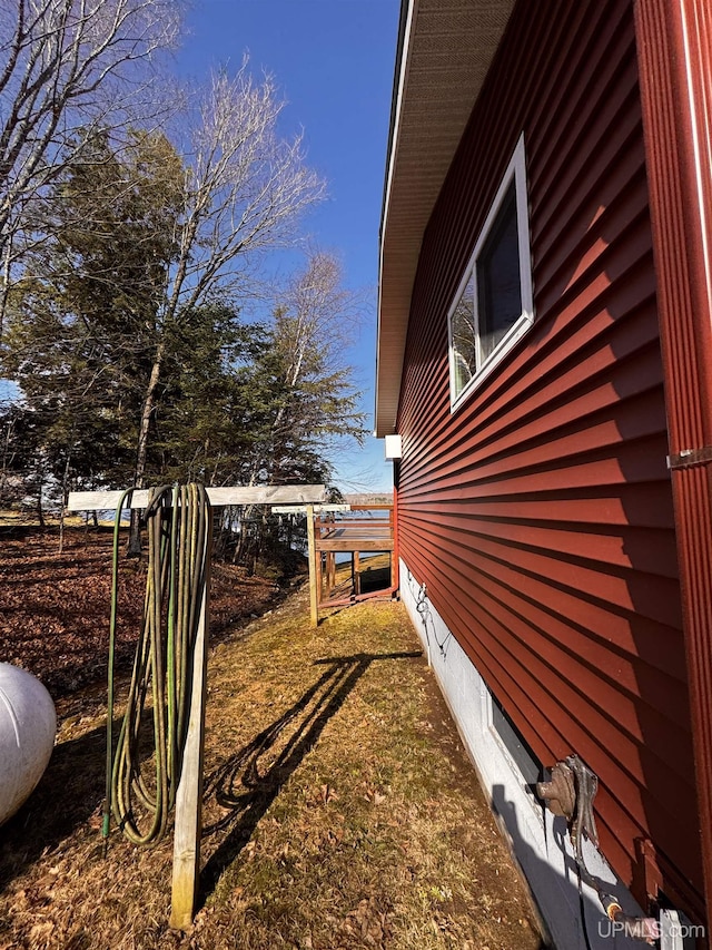 view of home's exterior with fence