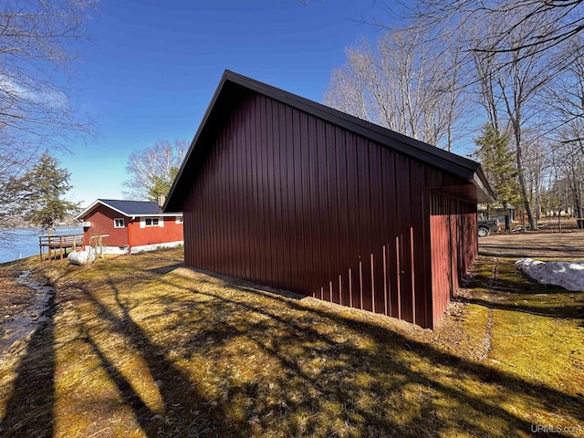 view of side of property featuring an outdoor structure