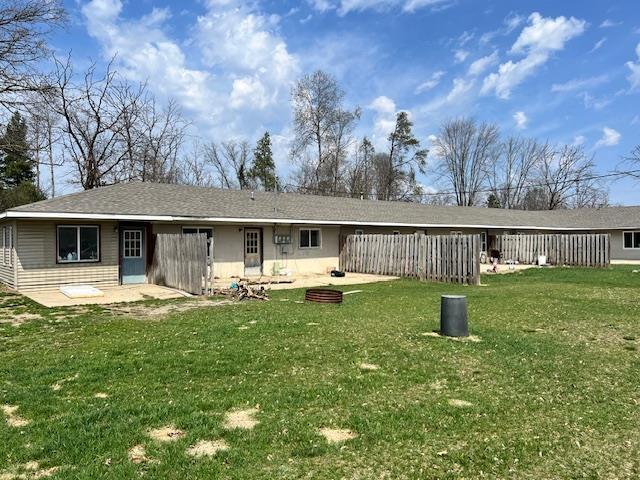 4110 N Clare Ave, Harrison, MI 48625 - rear view of property with a lawn and a patio