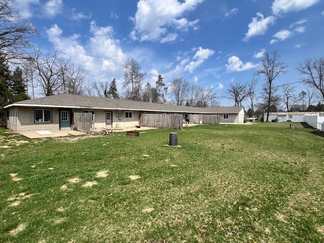 4110 N Clare Ave, Harrison, MI 48625 - rear view of property featuring a lawn