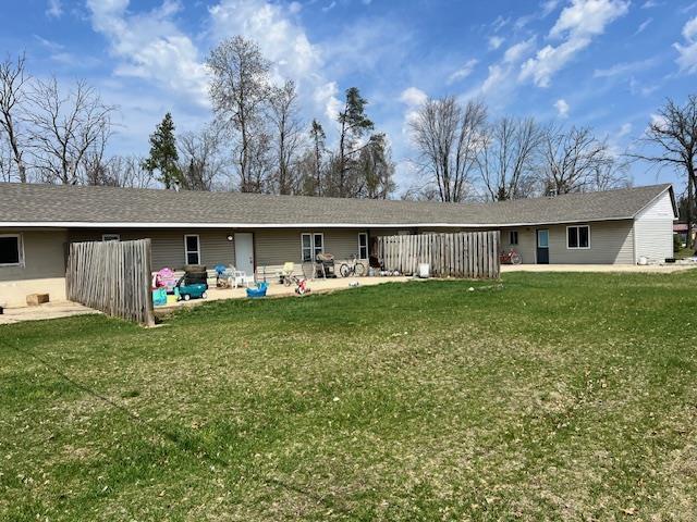 4110 N Clare Ave, Harrison, MI 48625 - rear view of house featuring a patio area and a yard