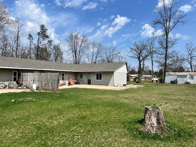 4110 N Clare Ave, Harrison, MI 48625 - rear view of house with a lawn and a patio area