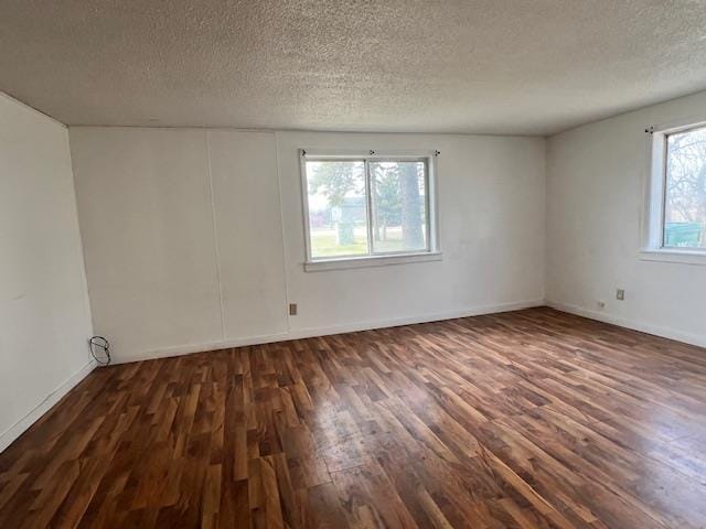 4110 N Clare Ave, Harrison, MI 48625 - empty room featuring baseboards, a textured ceiling, and wood finished floors