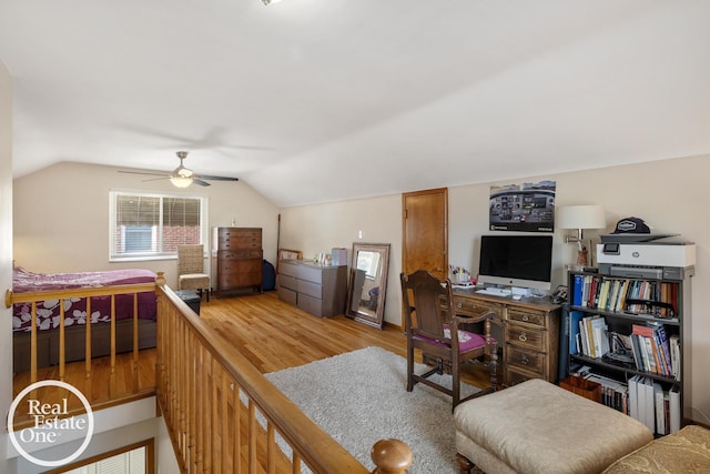 bedroom featuring lofted ceiling, light wood-style floors, and ceiling fan