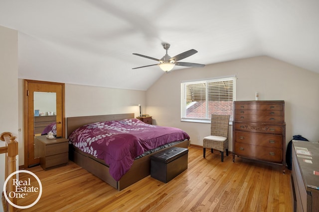 bedroom featuring light wood finished floors, ceiling fan, and lofted ceiling