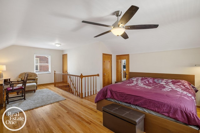 bedroom with wood finished floors, ceiling fan, and vaulted ceiling