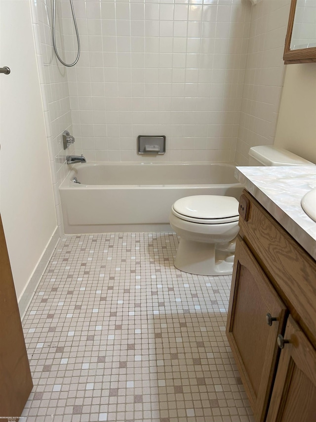 full bathroom with toilet, shower / bathing tub combination, tile patterned flooring, and vanity