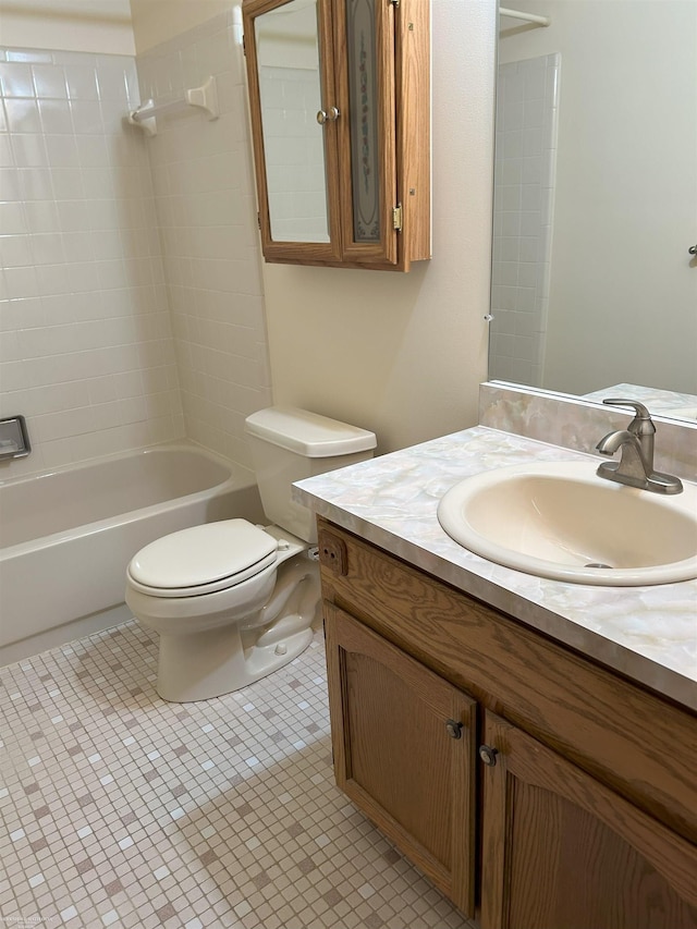 bathroom featuring toilet, shower / tub combination, and vanity