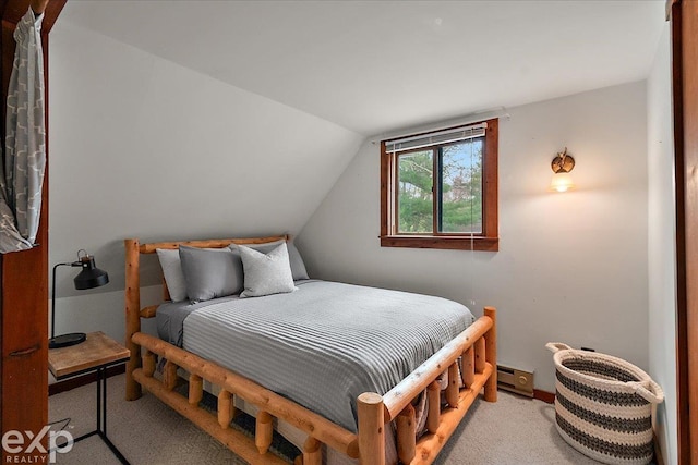 carpeted bedroom with lofted ceiling
