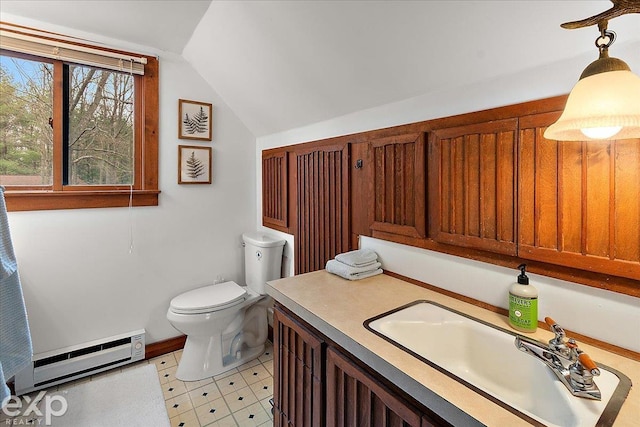 bathroom with a baseboard heating unit, toilet, vanity, baseboards, and lofted ceiling
