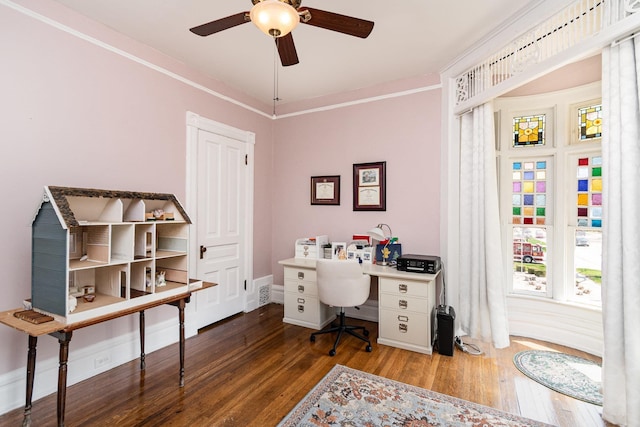 office with visible vents, ceiling fan, wood finished floors, and baseboards